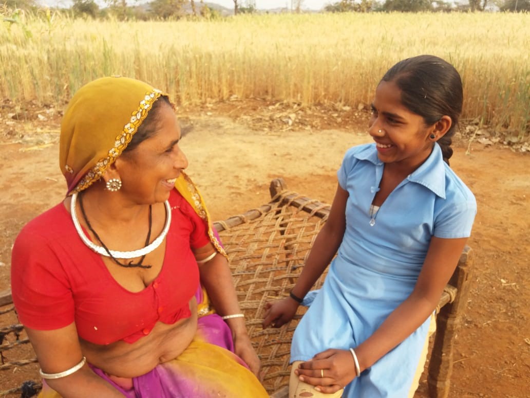 Women and adolescent discussing reproductive health